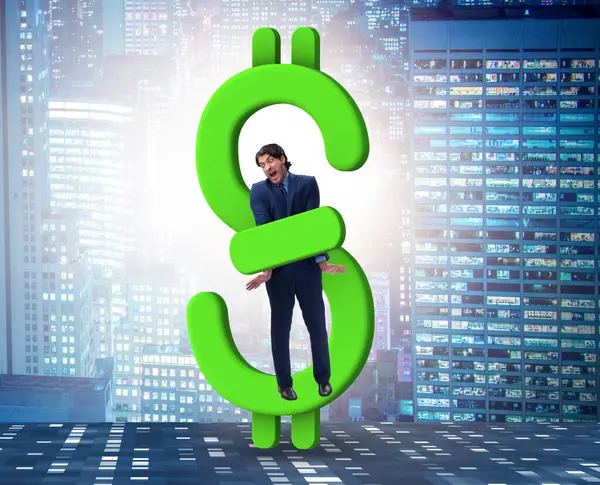 stock image The businessman in dollar and debt concept