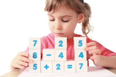 Little girl folds equalizations from cube clipart