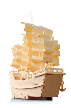 Homemade wooden ship with paper sails and flag, view from stern clipart