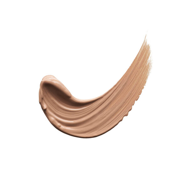 Нежно бежевые мазки макияжа или акриловая краска изолированы на белом фоне.