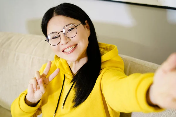 Asian Woman Takes Self Portrait Her Smartphone Smiling Broadly Showing — Stock Photo, Image