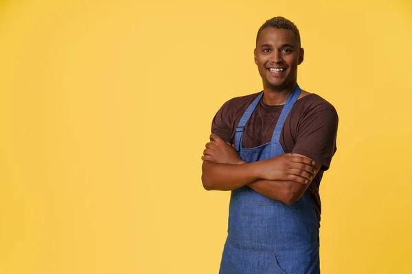 Cheerful African American Cook Wearing Blue Apron Smiles Front Yellow — Stock Photo, Image