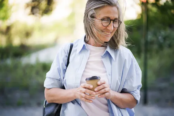 Woman Wearing Glasses Focused Her Cup Coffee Absorbed What She — Stock Photo, Image