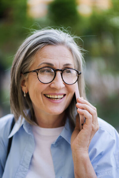Woman Glasses Engaged Phone Call Her Cell Phone Standing Outdoors Stock Picture