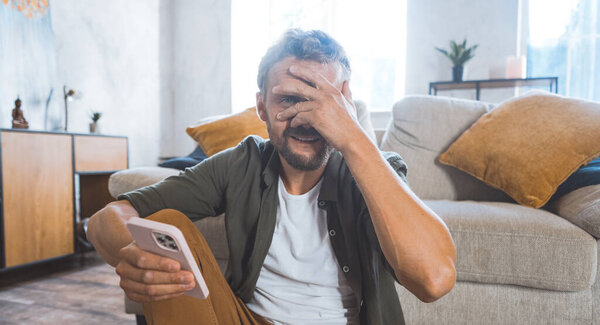 Man Sitting Couch Holding Cell Phone Royalty Free Stock Photos