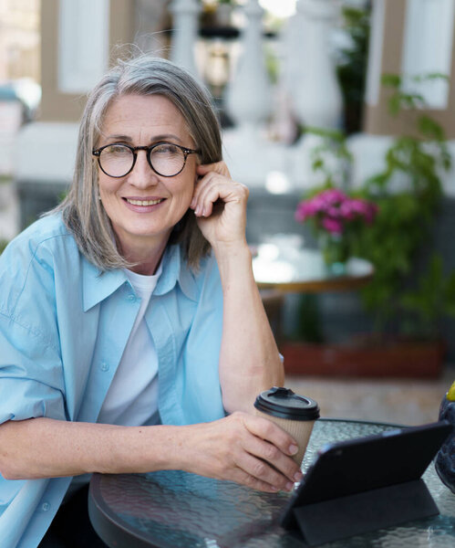 Woman Sits Table Holding Cup Coffee Front Her Stock Image
