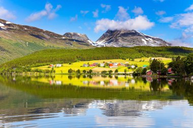 The lovely clean and calm lake Eidsvatnet. Warm sunny day in July. Northern Europe. Summer trip to Norway. 