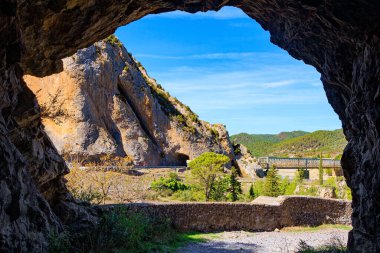Magnificent  dam collects the water of the Gallego River. Wonderful autumn day. La Jolla de Huesca. Indian summer in northern Spain