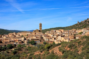 Aguero village at the foot of the dangerous and magnificent Mallos cliffs. Province of Huesca, Aragon. Romantic trip to northern Spain. The magical nature of Spain. 