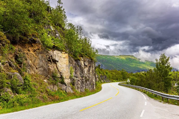 Scenic road in the mountains of Western Norway. Beginning of the Hardangerfjord. Scandinavia.  Magical journey in the cold northern country. Summer, July.