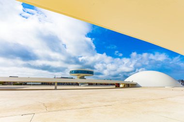 The complex consists of several futuristic buildings of white color and various shapes. Niemeyer Center. Spain. The picturesque town of Avilas in Asturias