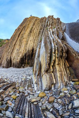 Flysch - unique landscape of underwater rocks exposed at low tide. Incredibly bizarre coastal cliffs. Playa Zumaya. The Basque Country - Itsurun. Coast of the Bay of Biscay, Atlantic. 