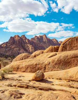 Stone red-orange remains of Spitzkoppe from coarse-grained granite. Spitzkoppe is a picturesque rock massif in Namibia. Namibia. Africa. 