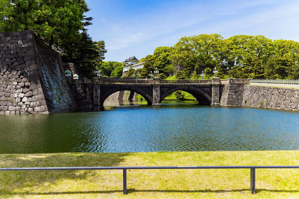 Imperial Palace in Tokyo. The residence of emperors and the Imperial court. Magnificent stone bridge across the moat surrounding the palace