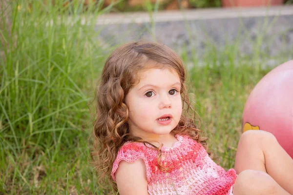 Girl Sits Huge Pink Ball Portrait Charming Little Girl Curly — Foto Stock