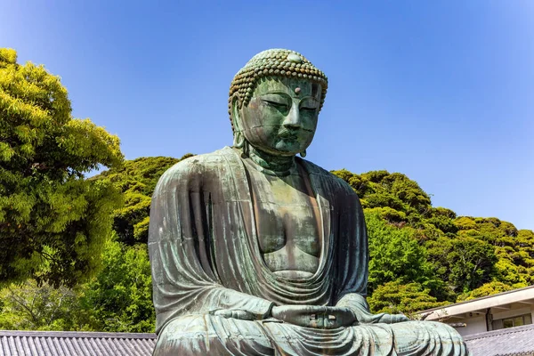 Kamakura şehrindeki dev Buda 'nın bronz heykeli ya da Kamakura Daibutsu. Buda, Saf Topraklar 'a giden yolu gösterir. Amida Buddha, Kamakura şehrinin sembolü oldu..