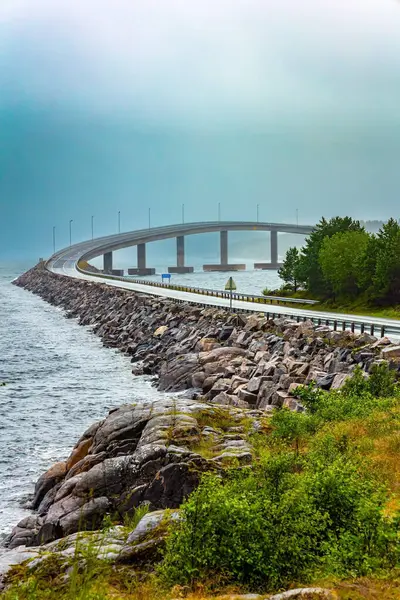Atlantic Road: the most beautiful road in the world. Norway. Cold and stormy July day. Scenic bridge over the ocean. Rain over the famous bridge in the icy sea.