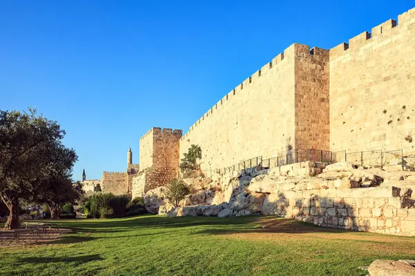 Protective walls of the Old City of Jerusalem at sunset. Jerusalem is the capital of Israel. Ancient citadel Tower of David near Jaffa Gate.
