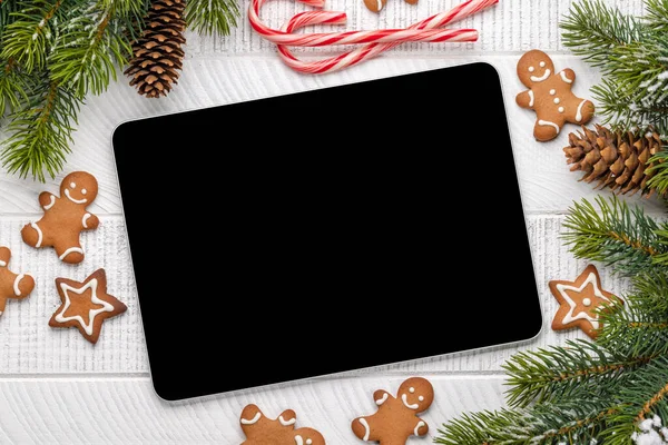 Tablet with blank screen and Christmas decor. Xmas device screen template
