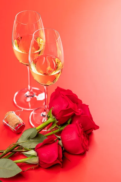 stock image Valentines day card with champagne and rose flowers. On red background with space for your greetings