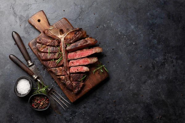 Grilled Porterhouse Beef Steak Sliced Bone Herbs Spices Top View — Stock Photo, Image