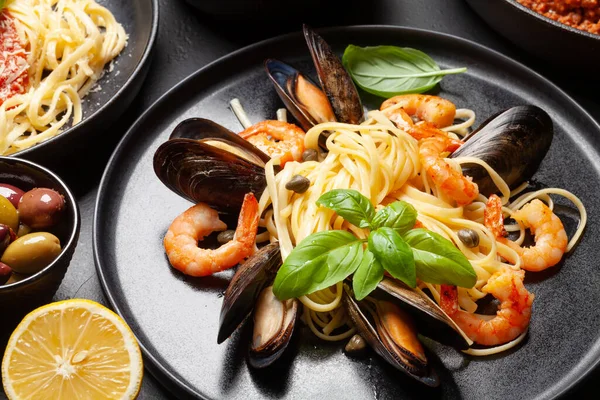 Various Italian pasta. Seafood pasta with shrimps and mussels