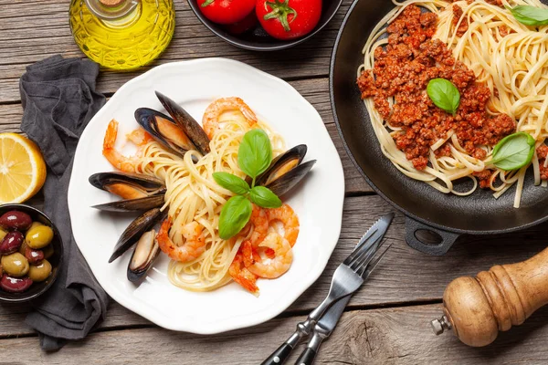 Various Italian pasta. Seafood pasta and spaghetti bolognese. Top view flat lay