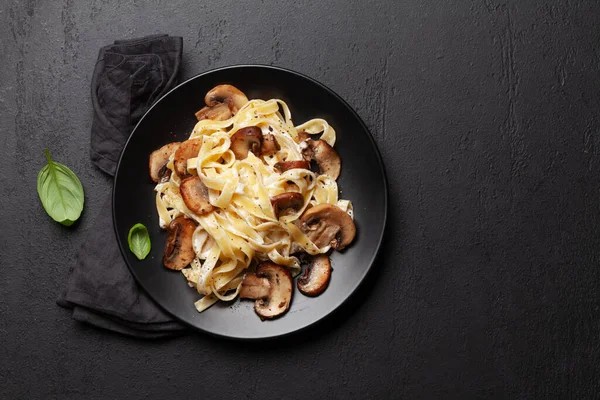 Various Italian pasta. Mushroom pasta with cream sauce. Top view flat lay with copy space