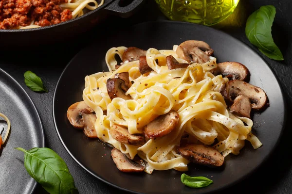 Various Italian pasta. Mushroom pasta with cream sauce