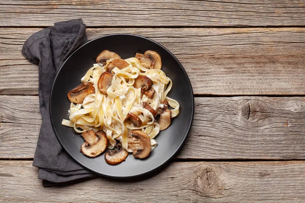 Various Italian pasta. Mushroom pasta with cream sauce. Top view flat lay with copy space