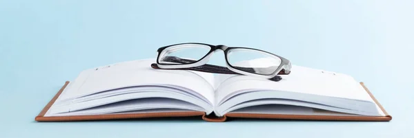 Notepad Glasses Blue Background Copy Space — Stock Photo, Image