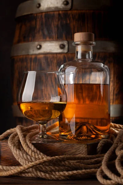 Glass Bottle Cognac Whiskey Golden Rum Front Old Wooden Barrel — Stock Photo, Image