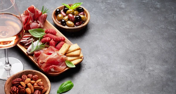 Antipasto Board Prosciutto Salami Crackers Cheese Nuts Olives Rose Wine — Stock Photo, Image