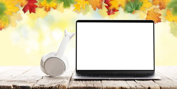 Laptop Blank Screen Headphones Wooden Table Front Autumn Backdrop Work — Fotografia de Stock