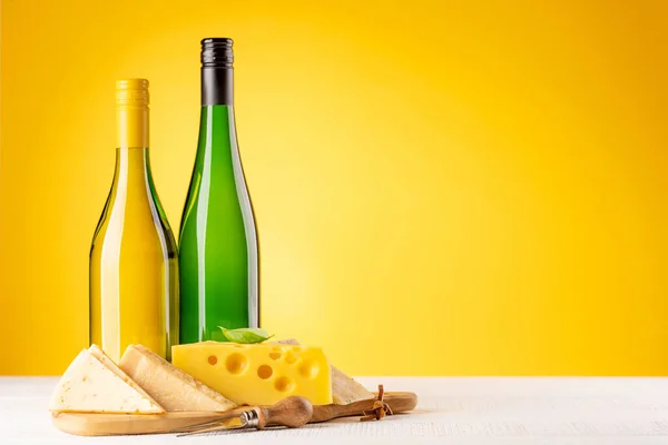Various Cheese Board White Wine Yellow Background Copy Space — Zdjęcie stockowe