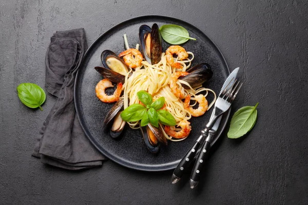Seafood pasta with shrimps and mussels. Top view flat lay