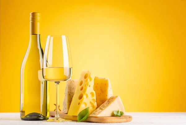Various Cheese Board White Wine Yellow Background Copy Space — Stock Fotó