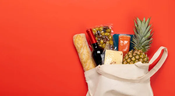 Shopping bag with wine and food. Flat lay with copy space