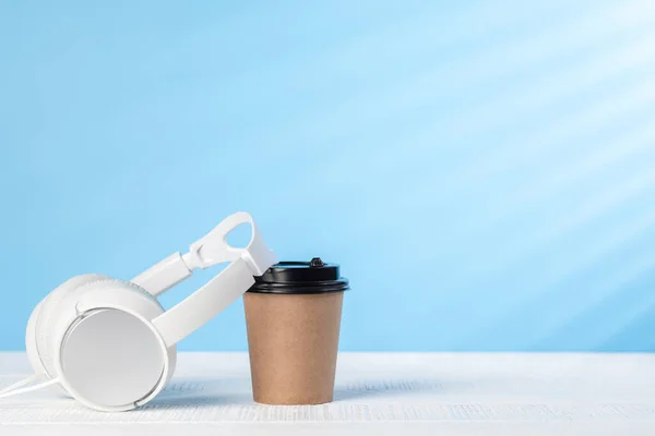 White Headphones Coffee Cup Blue Background Copy Space — ストック写真