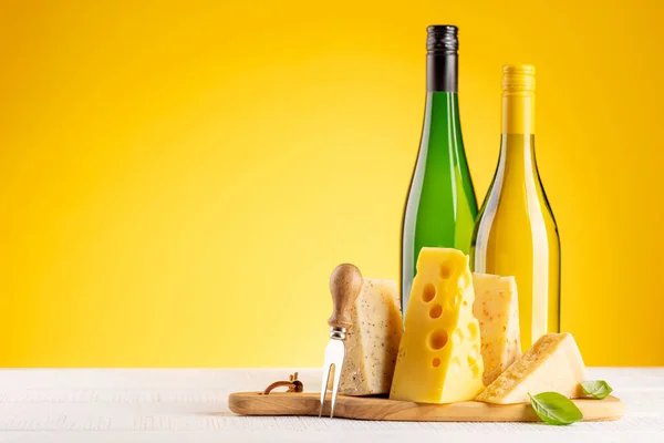Various Cheese Board White Wine Yellow Background Copy Space —  Fotos de Stock