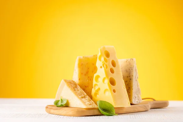 Various Cheese Board Yellow Background Copy Space — Foto Stock