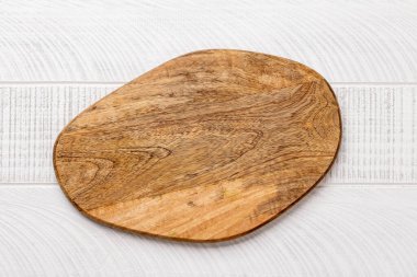 Wooden cutting board on kitchen table. Flat lay with copy space
