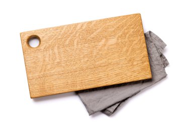 Wooden cutting board and kitchen towel. Isolated on white background. Flat lay with copy space