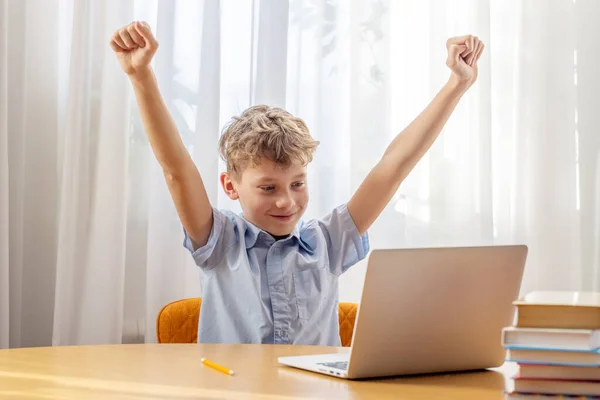 Excited Schoolboy Learning Online Laptop Desk Books Stationery — Stock Photo, Image