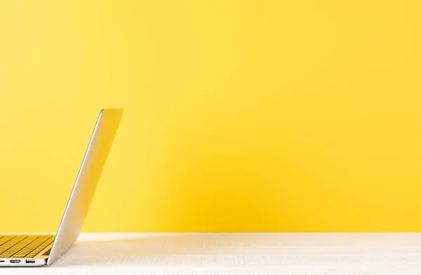 stock image Laptop on wooden table. Computer on desk with blank space for your text