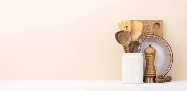 stock image Kitchen utensils on wooden table. Front view with copy space