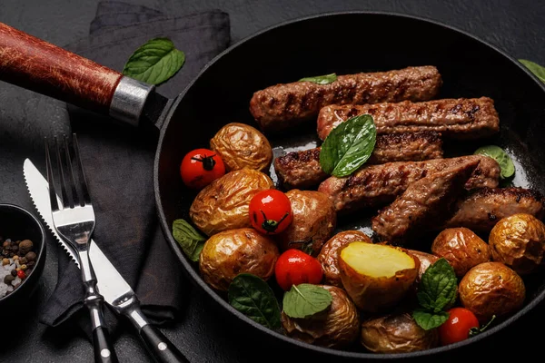 Delicious Grilled Sausages Potatoes Sizzling Frying Pan Closeup — Stock Photo, Image