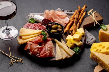Antipasto board with various meat and cheese snacks