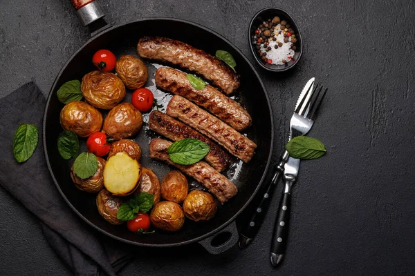Delicious Grilled Sausages Potatoes Sizzling Frying Pan Flat Lay Copy — Stock Photo, Image