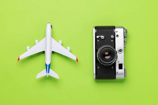 stock image Travel and vacation concept. Smartphone and camera on green desk